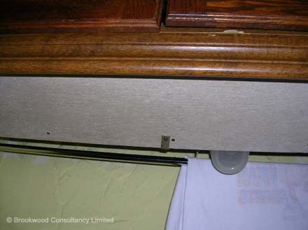 Asbestos Insulating Board Panel under Kitchen Unit
